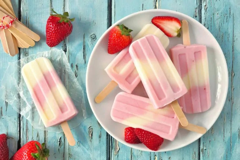 Homemade ice popcicles made with Vanilla & Strawberry Shake