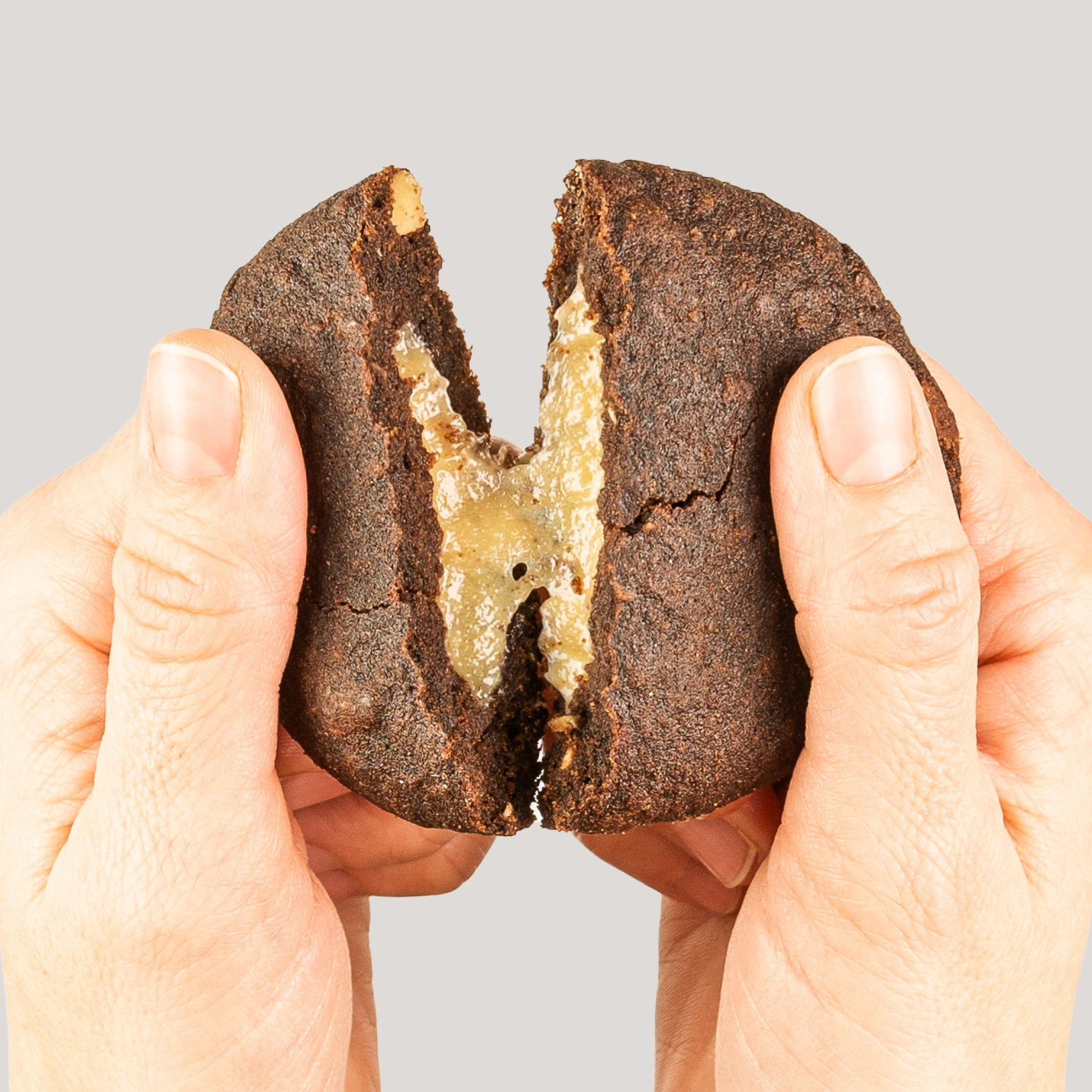 Nupo One Meal Bar Cookies & Cream bar in hand